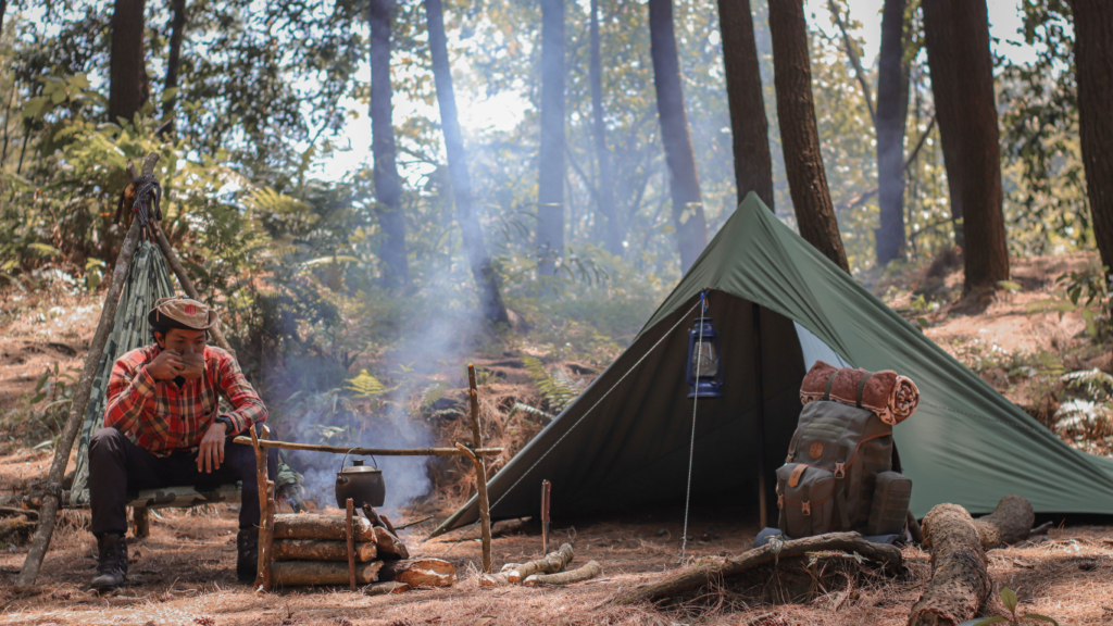 Man drinking coffee in the woods